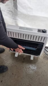 Propane heater used to warm dry suit divers between cold weather dives