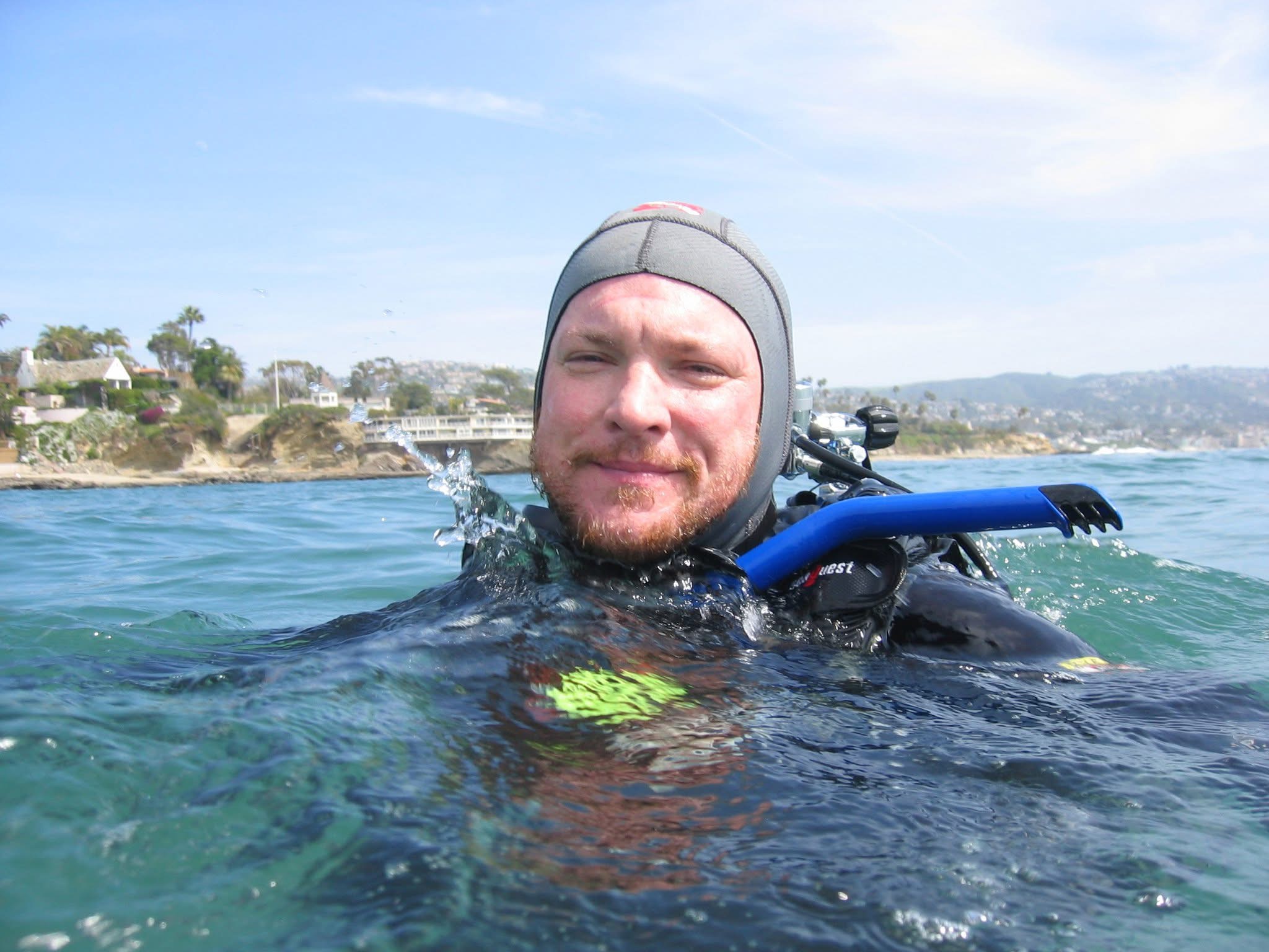 Frank Lewis smiling at the surface after a scuba dive.
